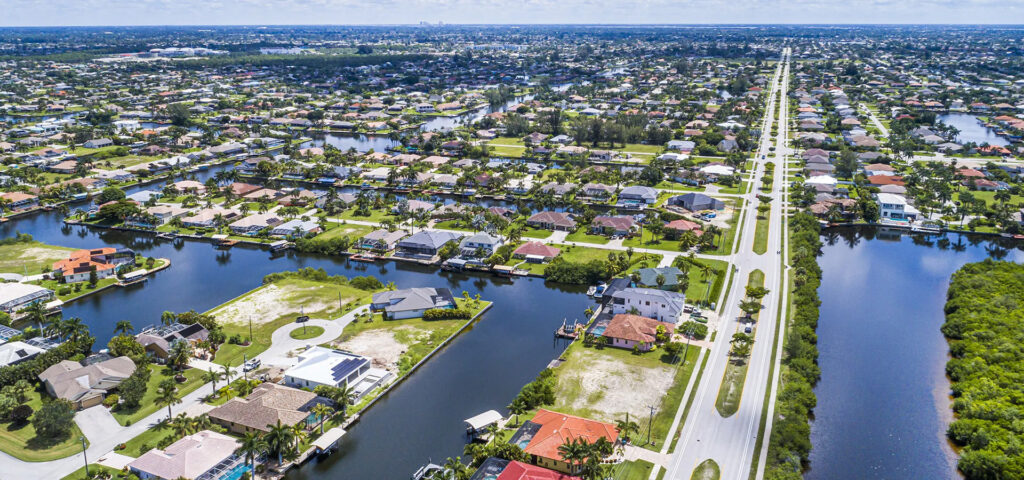 Aerial view of Cape Coral waterfront neighborhoods representing the home watch service areas served by Lee County Home Watch throughout Southwest Florida.